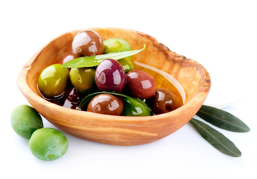 Wooden bowl with olives